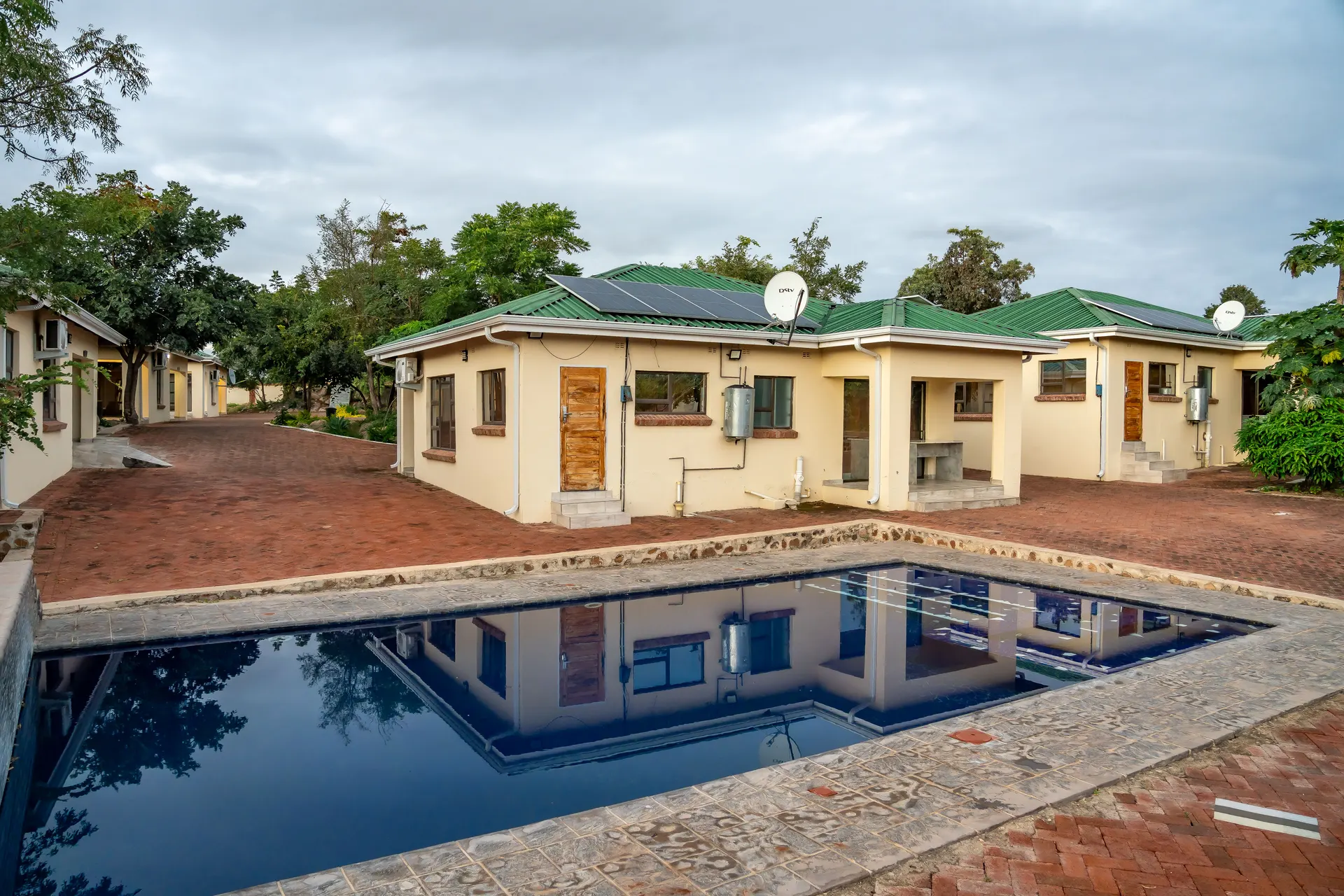 The pool and gardens at Elephant Executive Lodges